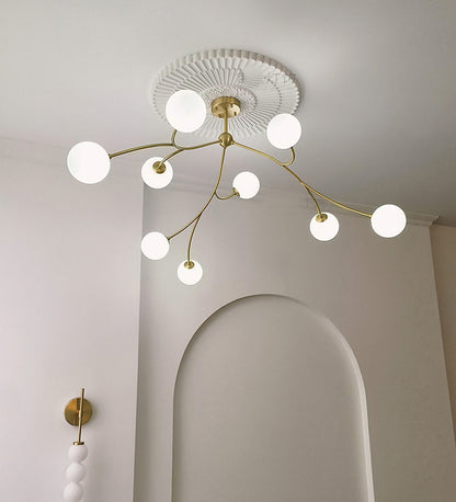 Golden Bloom chandelier with gold-tone branches and milky glass globes