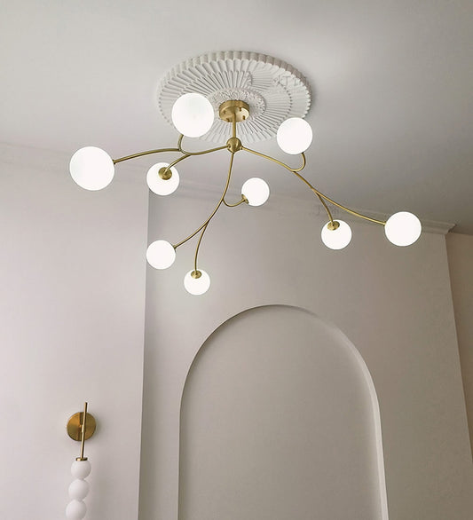 Golden Bloom chandelier with gold-tone branches and milky glass globes