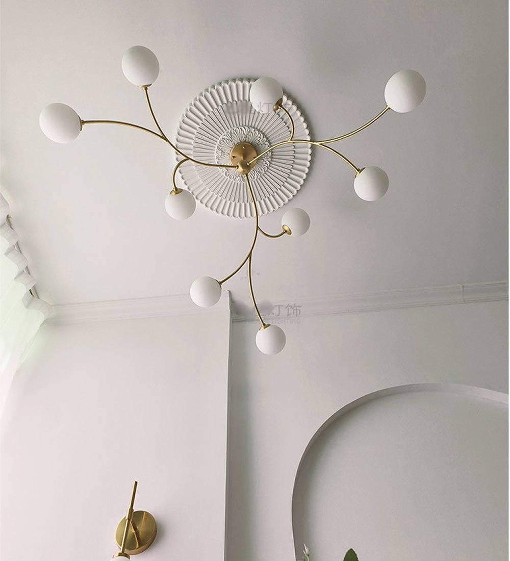 Golden Bloom chandelier with gold-tone branches and milky glass globes