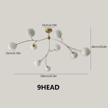 Golden Bloom chandelier with gold-tone branches and milky glass globes