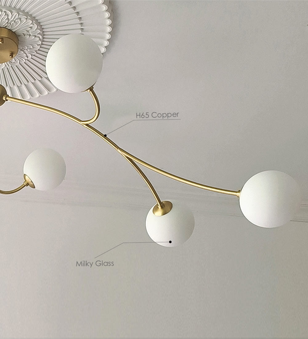 Golden Bloom chandelier with gold-tone branches and milky glass globes